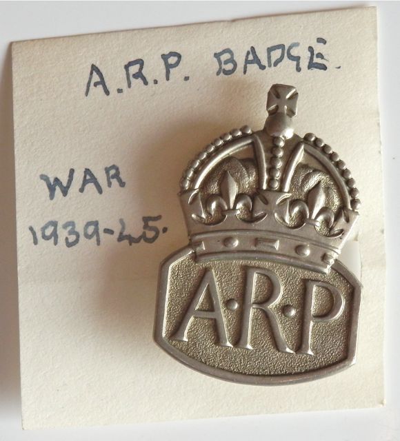 ARP identity coat badge